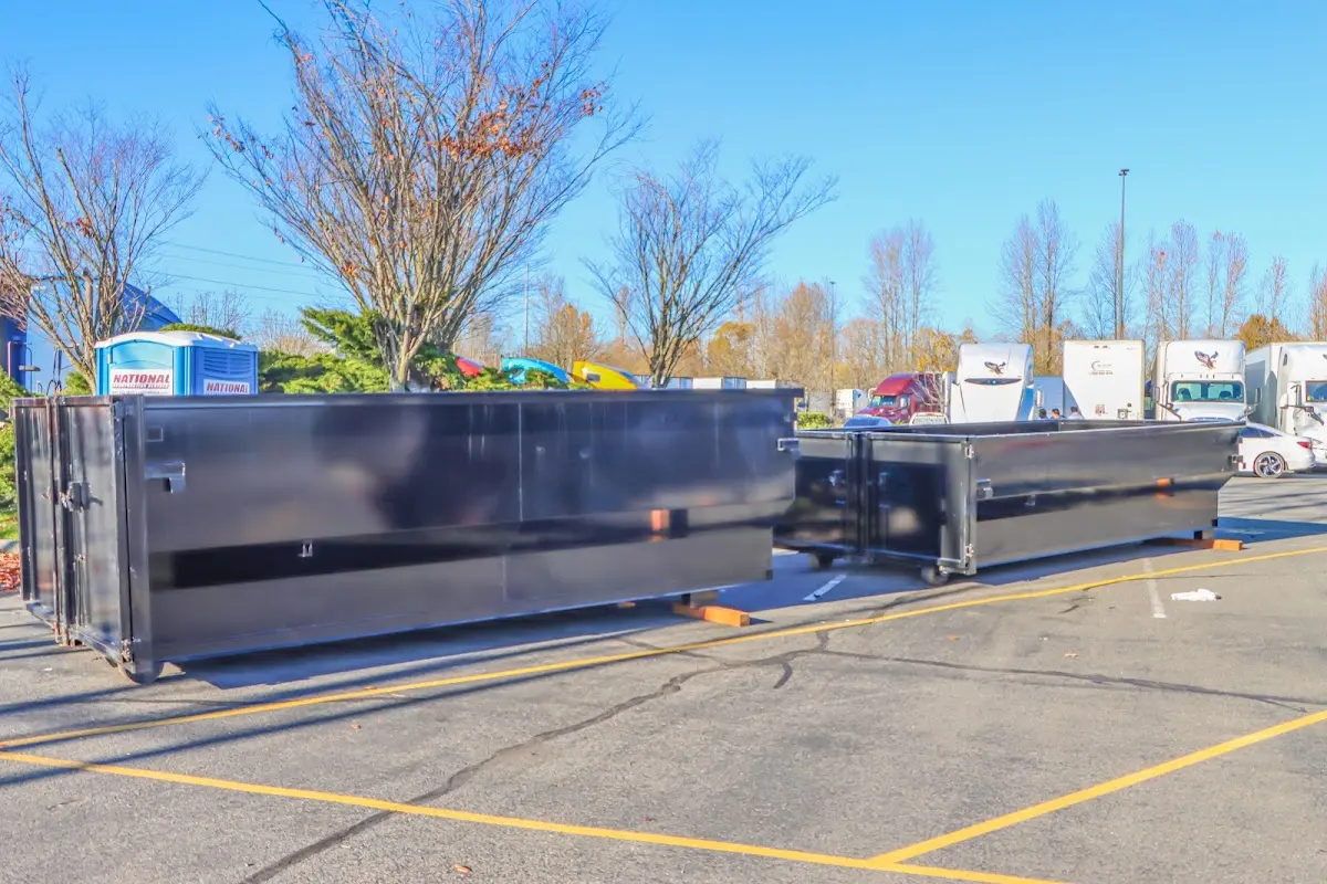 Professional dumpster rental service with roll-off container on residential driveway in Corte Madera